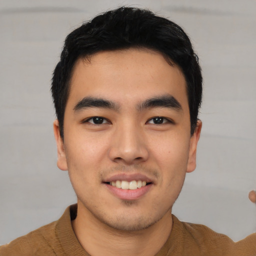 Joyful asian young-adult male with short  black hair and brown eyes