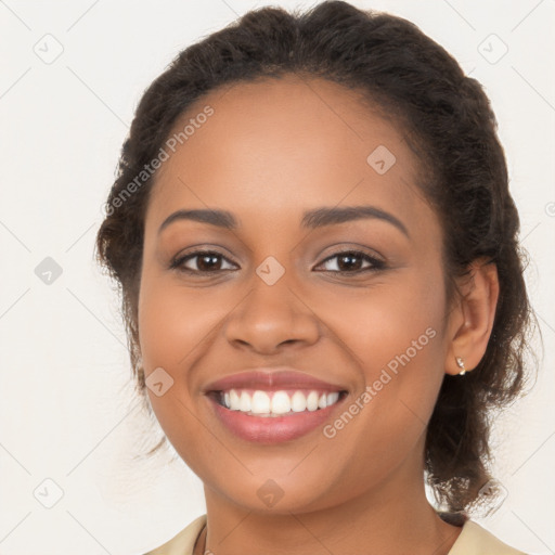 Joyful latino young-adult female with long  brown hair and brown eyes