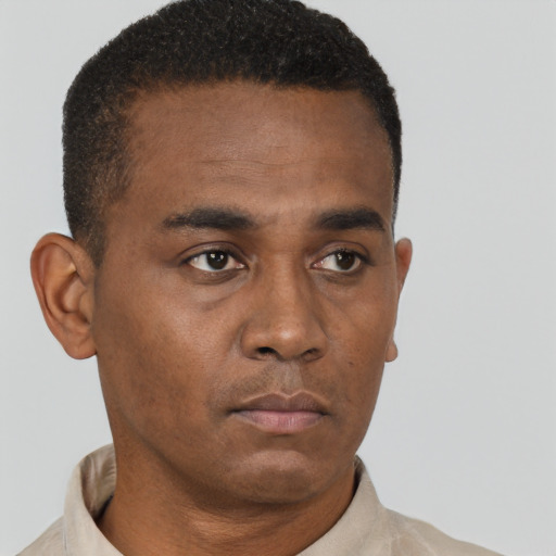 Neutral black young-adult male with short  brown hair and brown eyes
