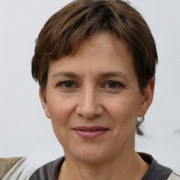 Joyful white adult female with short  brown hair and brown eyes