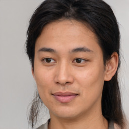 Joyful asian young-adult female with medium  brown hair and brown eyes