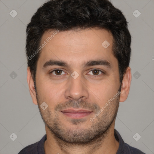 Joyful white young-adult male with short  black hair and brown eyes