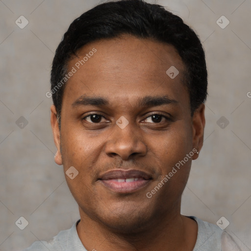 Joyful black young-adult male with short  black hair and brown eyes