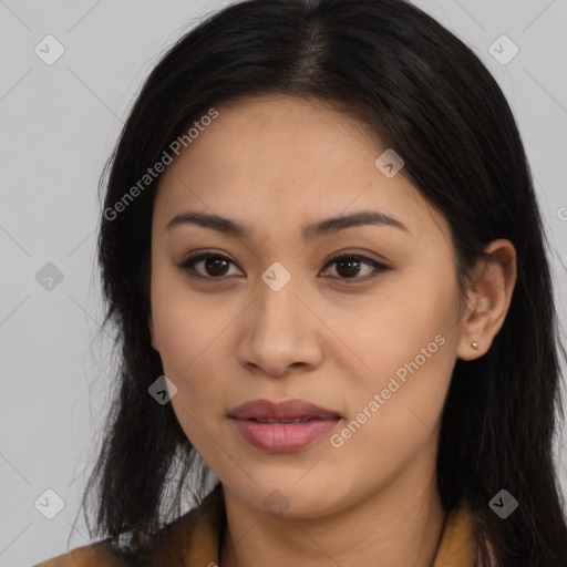 Joyful latino young-adult female with long  brown hair and brown eyes