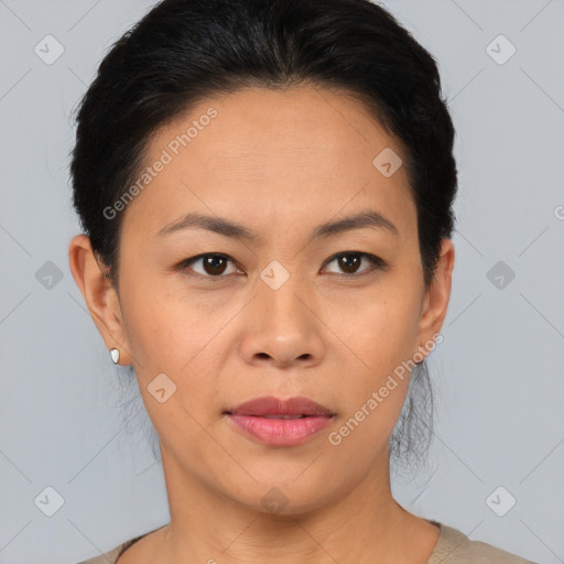 Joyful asian young-adult female with short  brown hair and brown eyes