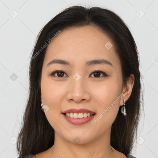 Joyful asian young-adult female with medium  brown hair and brown eyes