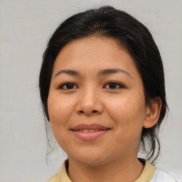 Joyful asian young-adult female with medium  brown hair and brown eyes