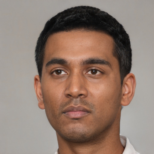 Neutral latino young-adult male with short  black hair and brown eyes