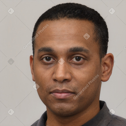 Neutral latino young-adult male with short  black hair and brown eyes