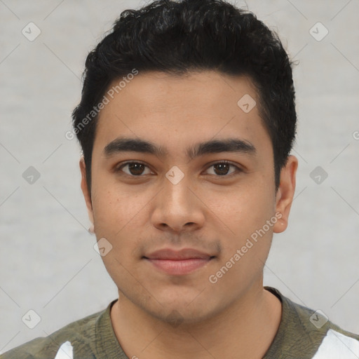 Joyful latino young-adult male with short  black hair and brown eyes