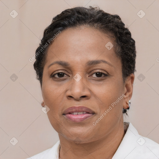 Joyful black adult female with short  brown hair and brown eyes