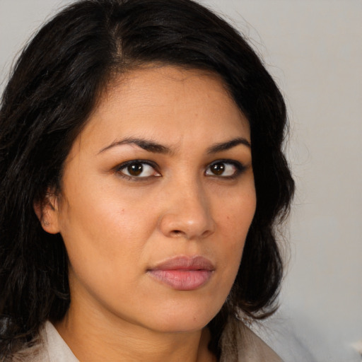 Neutral latino young-adult female with medium  brown hair and brown eyes