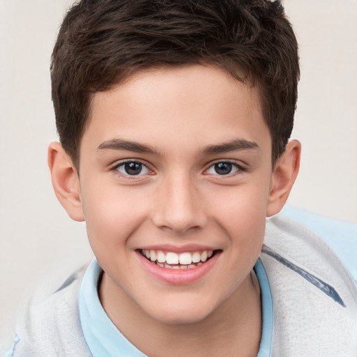 Joyful white child male with short  brown hair and brown eyes