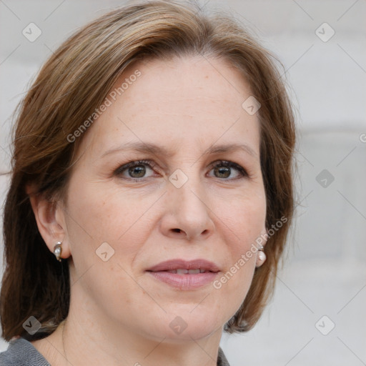 Joyful white adult female with medium  brown hair and blue eyes