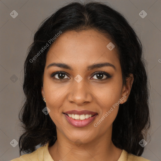 Joyful black young-adult female with medium  brown hair and brown eyes