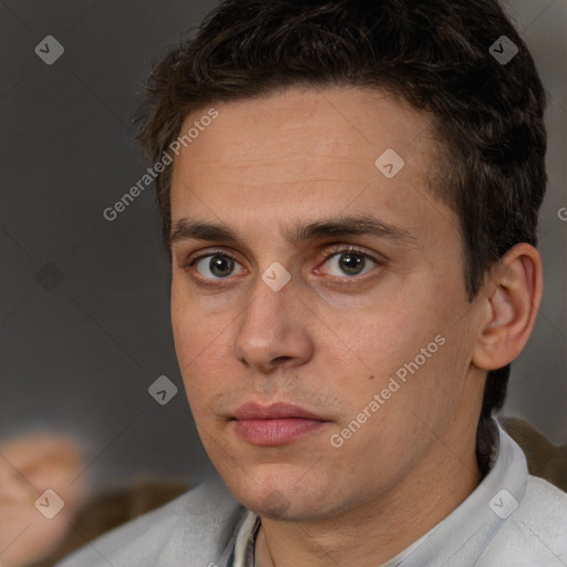 Neutral white young-adult male with short  brown hair and brown eyes