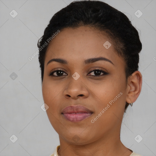 Joyful black young-adult female with short  brown hair and brown eyes