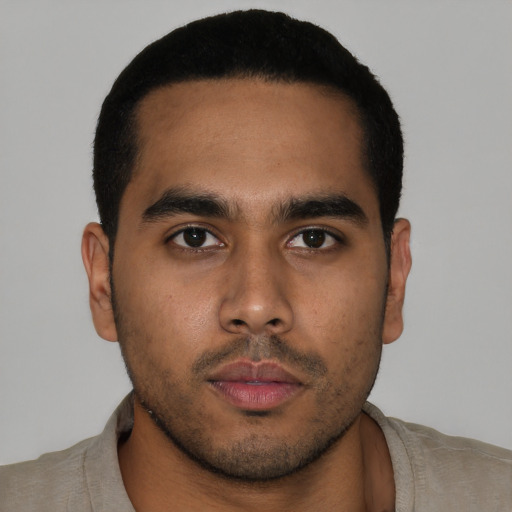 Neutral latino young-adult male with short  brown hair and brown eyes