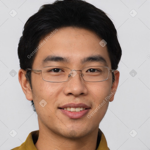 Joyful asian young-adult male with short  brown hair and brown eyes