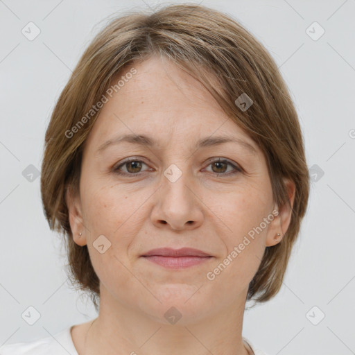 Joyful white adult female with medium  brown hair and grey eyes