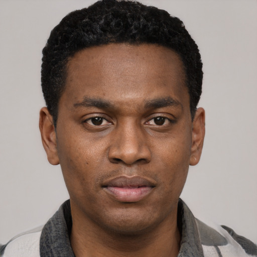 Neutral black young-adult male with short  black hair and brown eyes