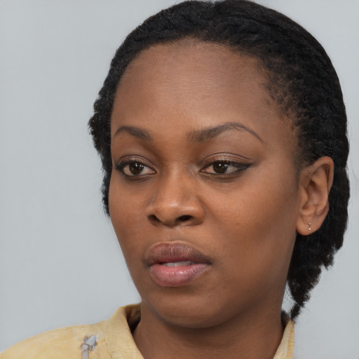Neutral black young-adult female with short  black hair and brown eyes