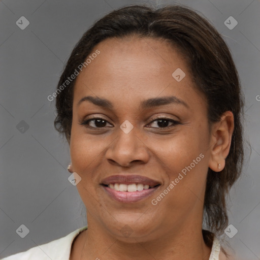 Joyful latino young-adult female with medium  brown hair and brown eyes