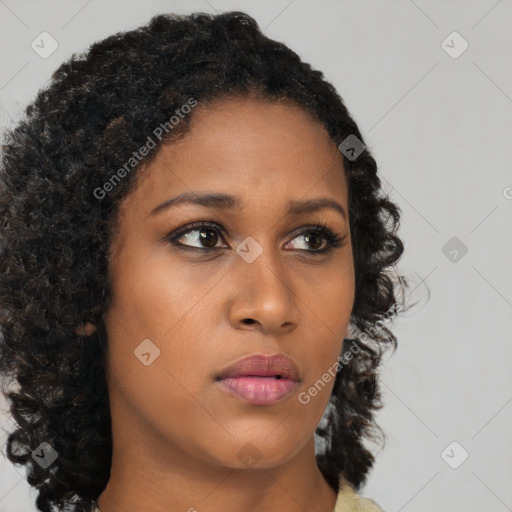 Neutral black young-adult female with medium  brown hair and brown eyes