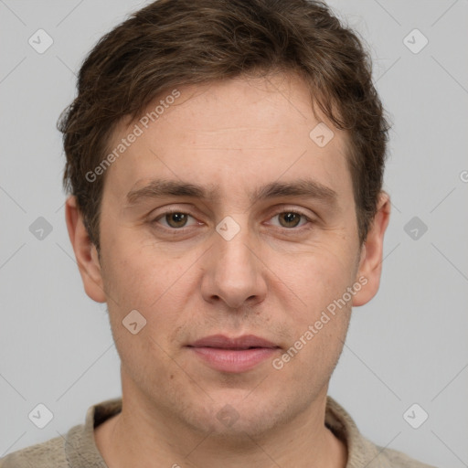 Joyful white adult male with short  brown hair and grey eyes