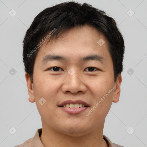 Joyful asian young-adult male with short  brown hair and brown eyes