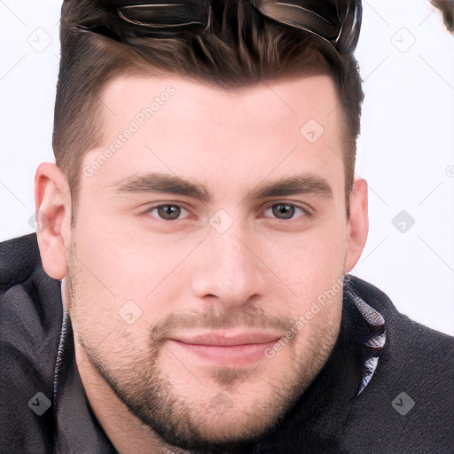 Joyful white young-adult male with short  brown hair and grey eyes