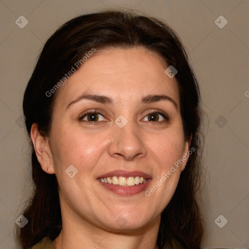 Joyful white adult female with medium  brown hair and brown eyes