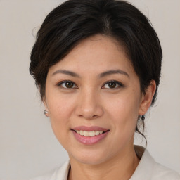 Joyful white young-adult female with medium  brown hair and brown eyes