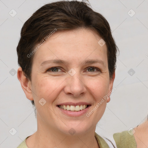 Joyful white young-adult female with short  brown hair and grey eyes