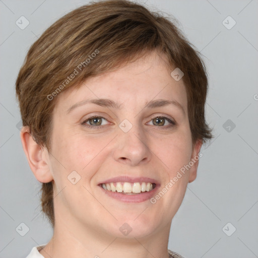 Joyful white young-adult female with short  brown hair and grey eyes