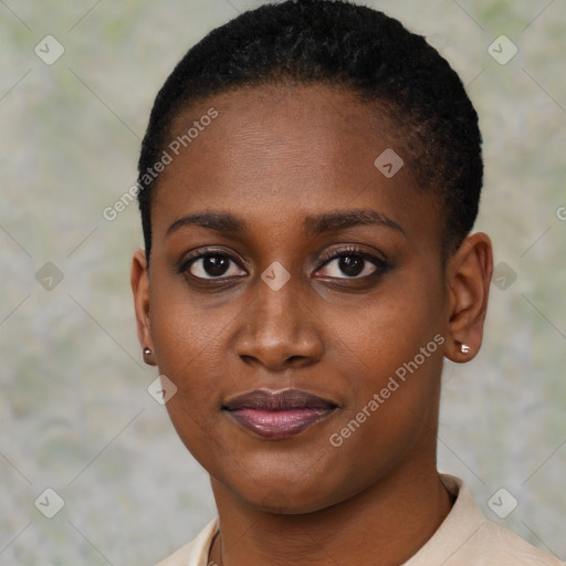 Joyful black young-adult female with short  black hair and brown eyes