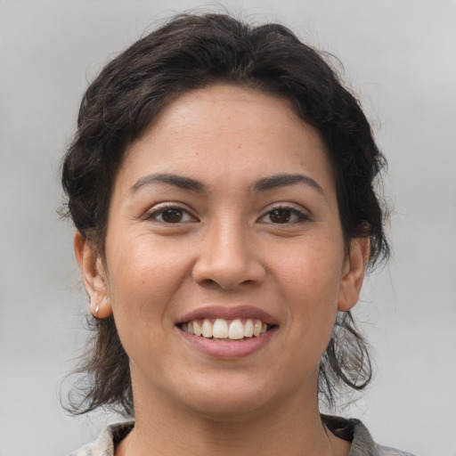 Joyful asian young-adult female with medium  brown hair and brown eyes
