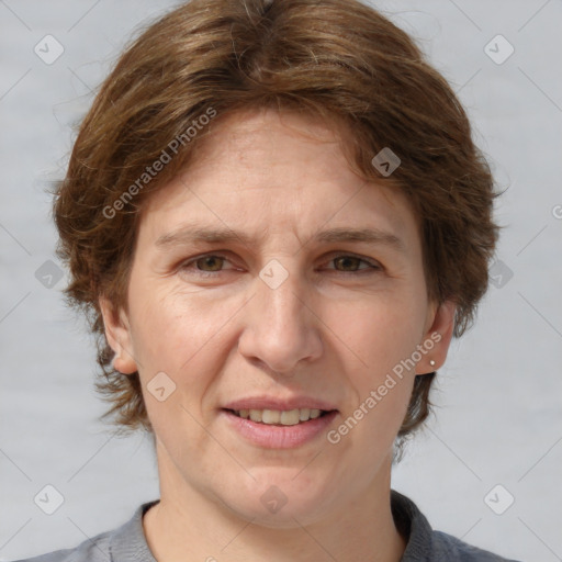 Joyful white adult female with medium  brown hair and grey eyes