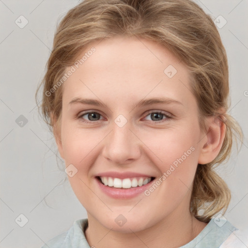 Joyful white young-adult female with medium  brown hair and blue eyes