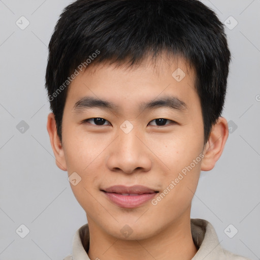 Joyful asian young-adult male with short  black hair and brown eyes