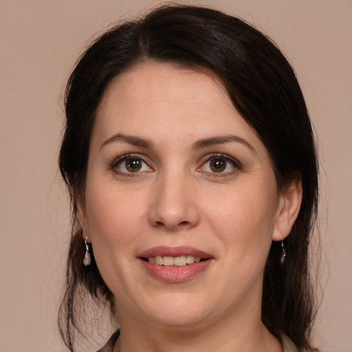 Joyful white adult female with medium  brown hair and brown eyes