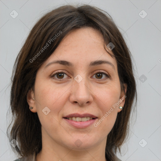 Joyful white adult female with medium  brown hair and brown eyes