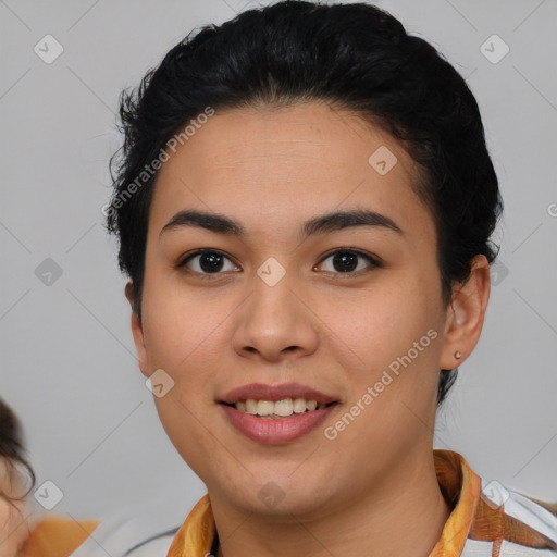 Joyful latino young-adult female with short  brown hair and brown eyes