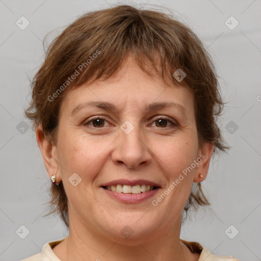 Joyful white adult female with medium  brown hair and brown eyes