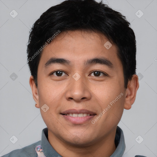 Joyful asian young-adult male with short  brown hair and brown eyes