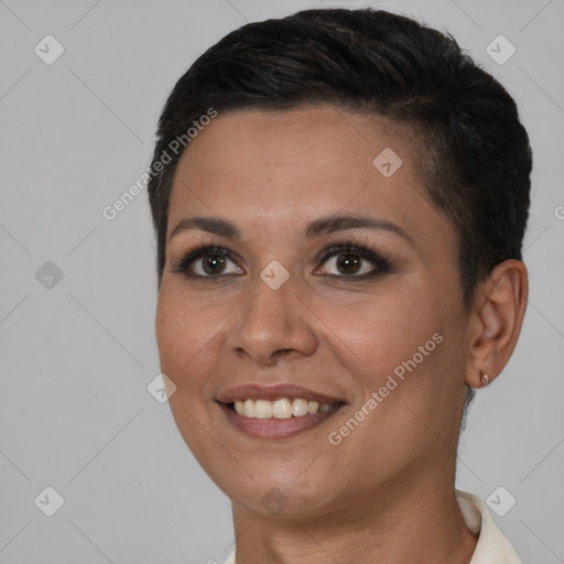 Joyful black young-adult female with short  brown hair and brown eyes