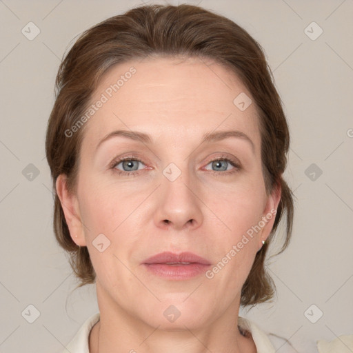 Joyful white adult female with medium  brown hair and grey eyes