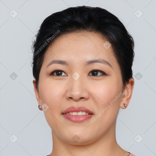 Joyful asian young-adult female with short  black hair and brown eyes