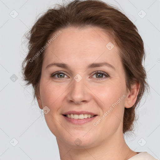 Joyful white adult female with short  brown hair and grey eyes