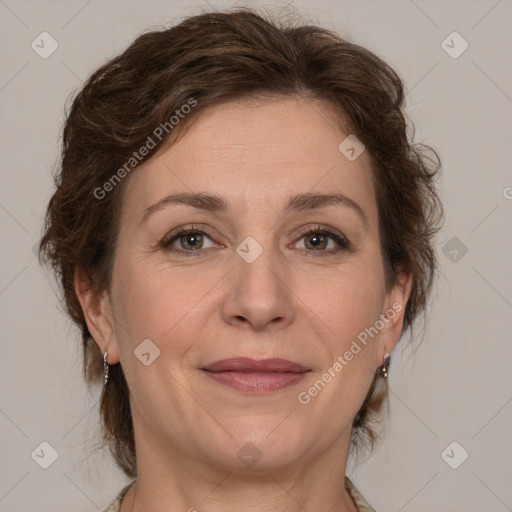 Joyful white adult female with medium  brown hair and grey eyes